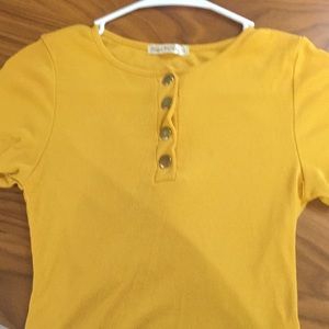 A small yellow golden shirt